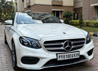 Mercedes-Benz E-Class outside a residential tower – Om Shakthi Travels, Chennai