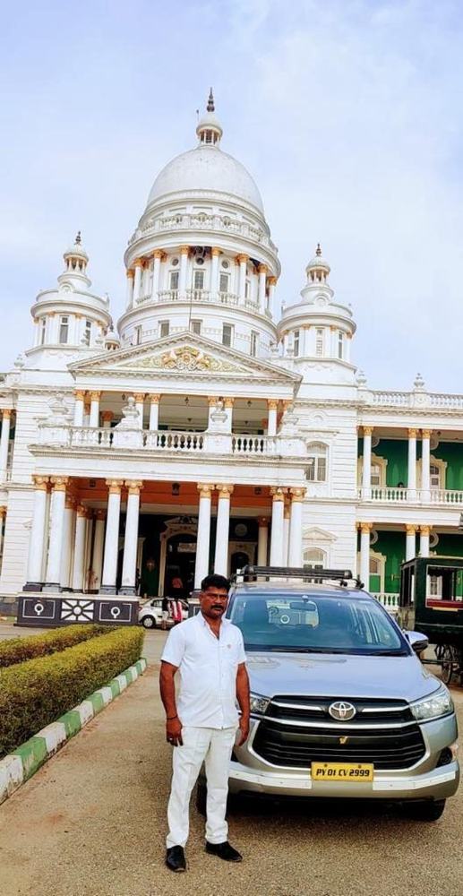 Chauffeur with the car at a heritage stop – Om Shakthi Travels, Chennai
