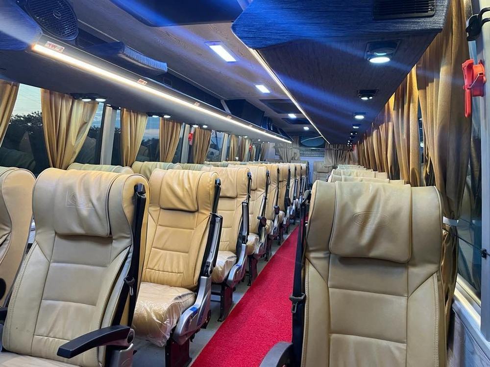 Pushback seats inside a luxury coach – Om Shakthi Travels, Chennai