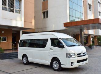White Toyota Commuter van for group travel in Chennai