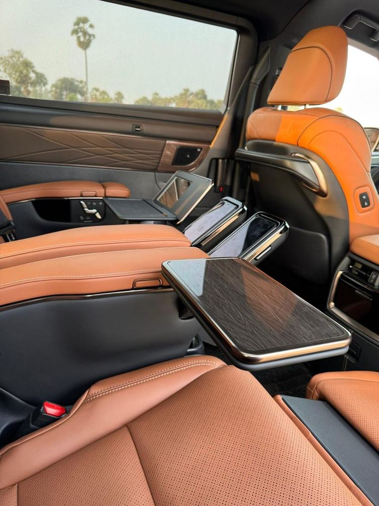 Vellfire lounge seat with fold-out table – Om Shakthi Travels, Chennai