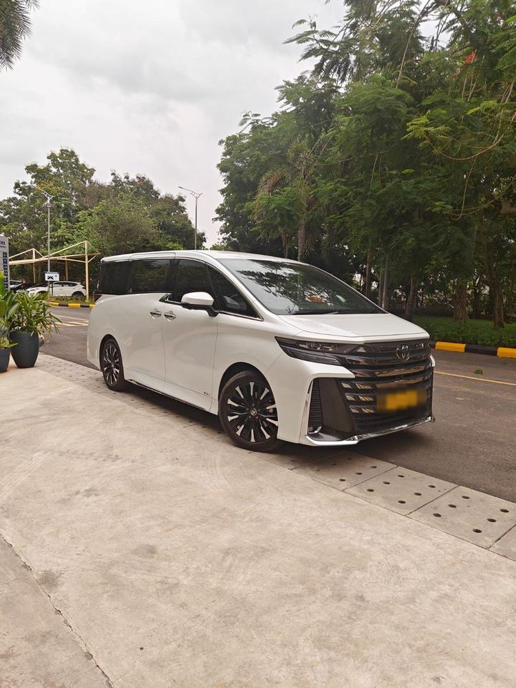 White Toyota Vellfire parked at a Chennai office campus