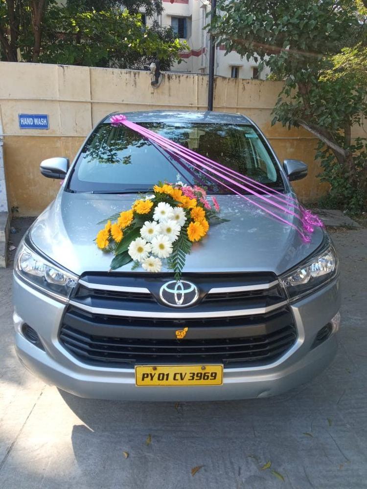 Innova decorated with flowers for a wedding – Om Shakthi Travels, Chennai