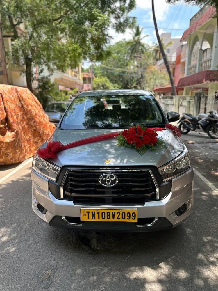 Wedding car with red ribbon and roses – Om Shakthi Travels, Chennai